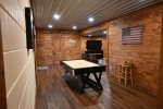 Large Game Room sporting Air Hockey and Video Console